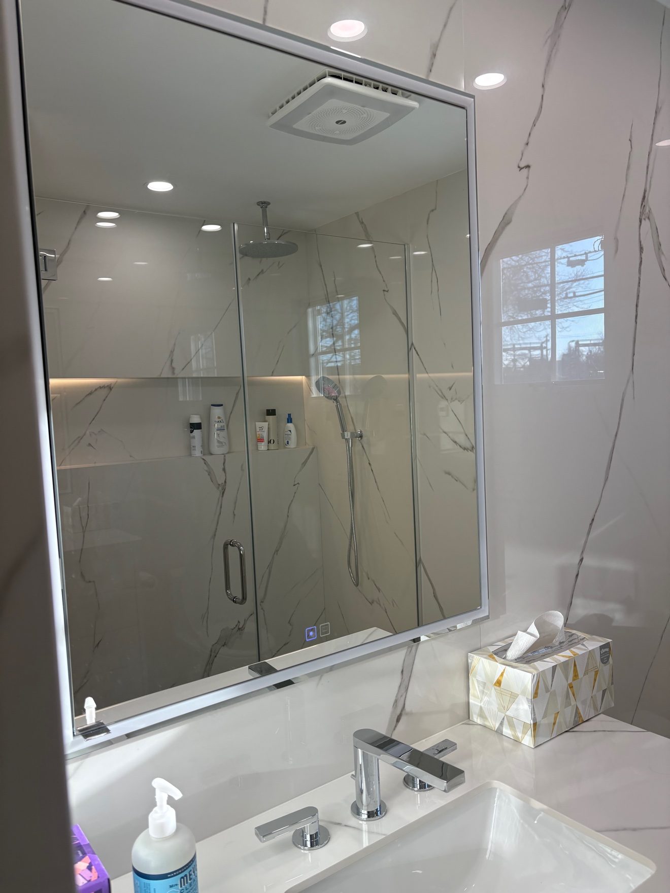 Bathroom remodel — vanity and backlit mirror.